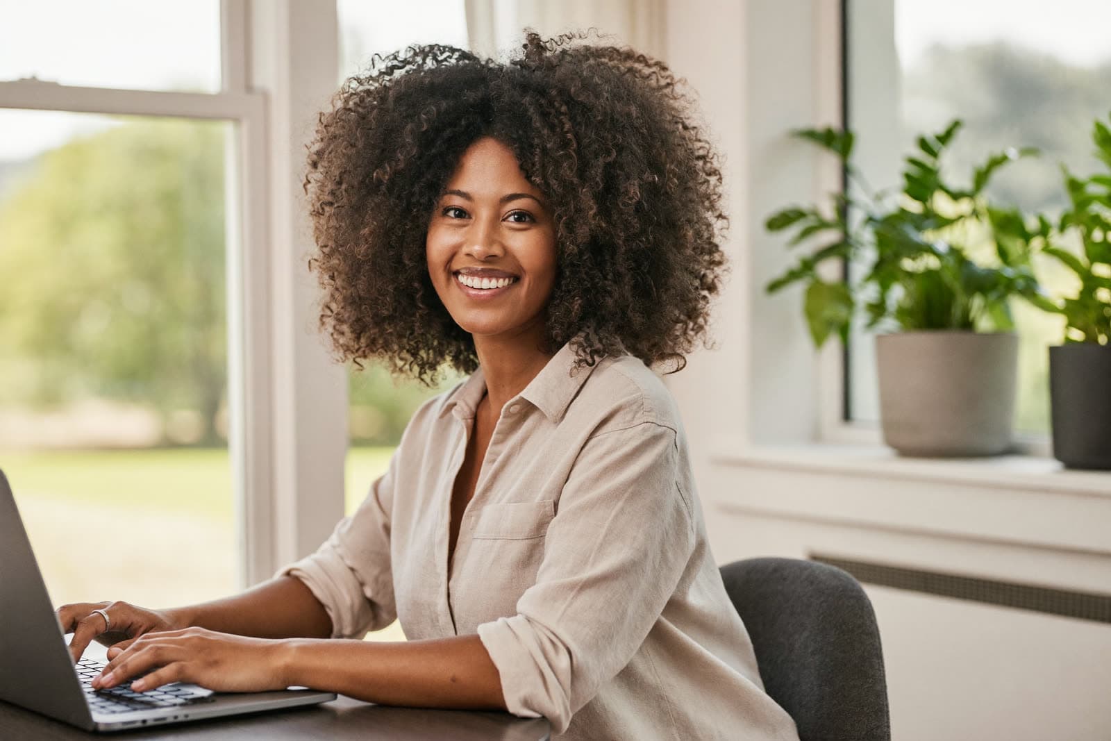 A self-employed Better Choice member working confidently from her bright home office